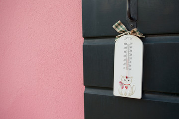 termometer standing out from a traditional house in Burano islan