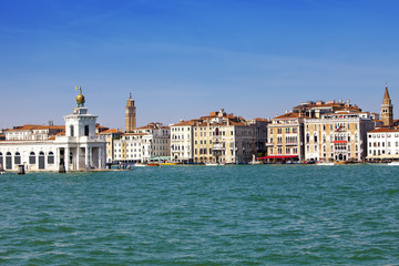 Fototapeta na wymiar Venice. Italy. Bright ancient buildings ashore Canal Grande