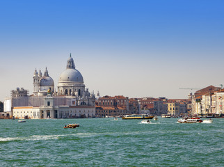 Fototapeta na wymiar Grand Canal with boats and Basilica Santa Maria della Salute, Venice, Italy..