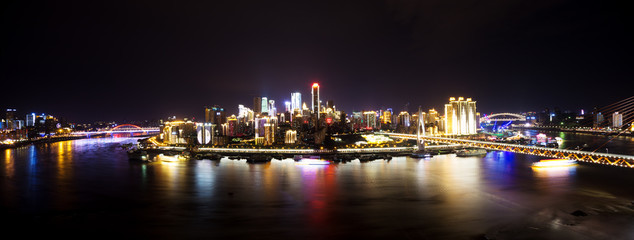 Fototapeta na wymiar cityscape and skyline of downtown near water of chongqing at nig