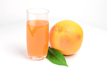 Glass of pink grapefruit juice isolated on white