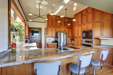 Great kitchen room with high ceiling and modern cabinets.