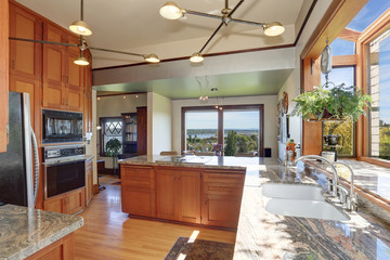 Great kitchen room with high ceiling and modern cabinets.
