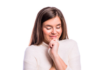 Fototapeta premium Girl in white sweater, young woman, studio shot