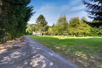 American country house exterior with asphalt driveway .