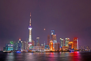 Obraz premium Night view of Pudong riverfront buildings and the pearl tower. one of the most famous tourist destinations in Shanghai.