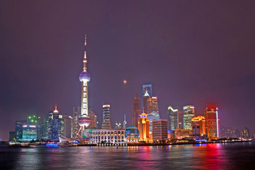 Night view of Pudong riverfront buildings and the pearl tower. one of the most famous tourist destinations in Shanghai.