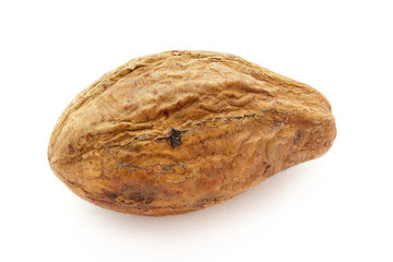 Organic dry Harad (Terminalia chebula) isolated on white background. Macro close up. Top view.