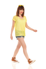 Fototapeta premium Woman Walks In Brown Sneakers