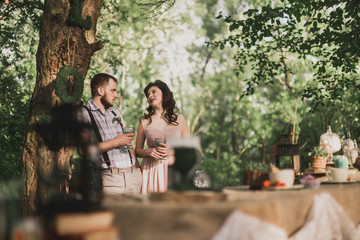 Man and woman have dinner in the park. banquet  outdoor