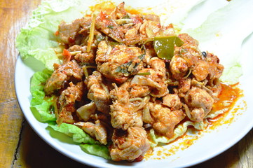 spicy stir fried chicken with herb on fresh Chinese cabbage