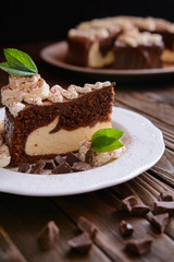 Piece of chocolate cheesecake with whipped cream