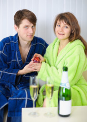 Young man gives a girl a gift