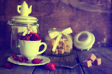 toned photo tea cup with sugar cubes