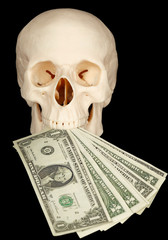 Horrible skull with bundle of money in mouth