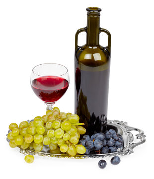 Bottle of red wine, glass and grapes - still life