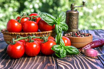 cherry tomatoes ,  basil, pepper and pepper-mill