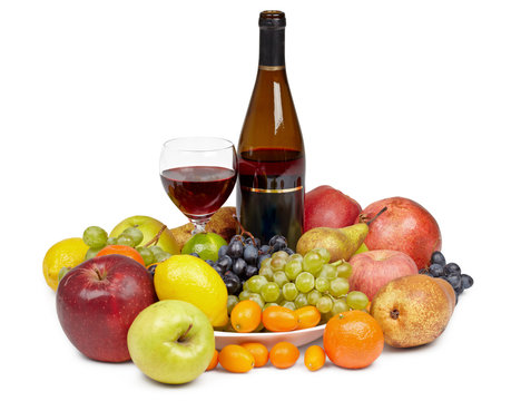 Bottle of wine and glass surrounded by fruit