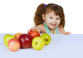 Fototapeta na wymiar Little cheerful girl with apples