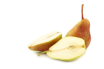 fresh "Forelle" pear and a cut one on a white background