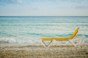 Fototapeta na wymiar deckchair, seashore, caribbean see.