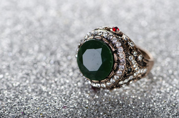 Jewellery ring against shiny background