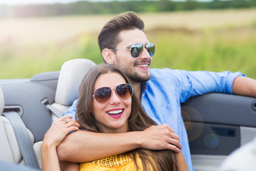 Couple enjoying a drive in a convertible
