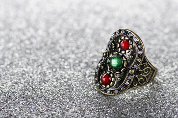 Jewellery ring against shiny background