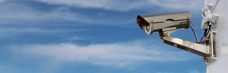 security camera panorama with blue cloudy sky