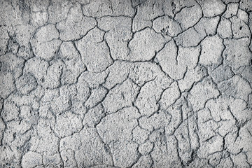 Deep large cracks on surface of plaster