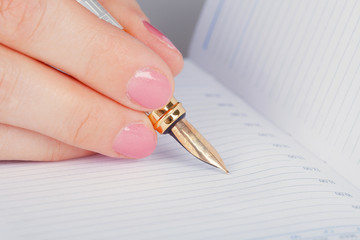 Golden pen and notebook