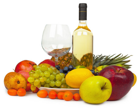 Still-life from wine and fruits on white background