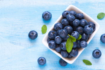 Fresh blueberriaes in white plate