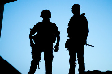 soldier silhouette knife gun