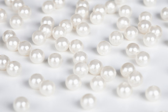 Fake pearls scattered on table