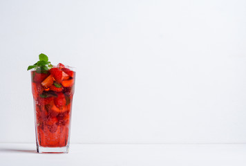 Strawberry mojito cocktail on the wooden background