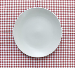 the plate on checkered tablecloth