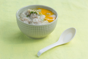 porridge rice gruel in bowl with pork