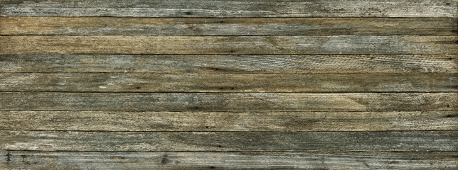 panoramic grunge background of old wood boards toned effect