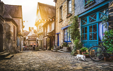 Fototapety  Old town in Europe at sunset with retro vintage Instagram style filter and lens flare effect