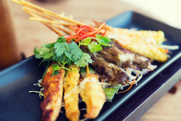 close up of deep-fried asian snacks on plate
