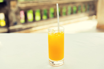glass of fresh orange fruit juice at restaurant