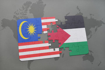 puzzle with the national flag of malaysia and palestine on a world map background.