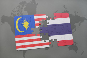 puzzle with the national flag of malaysia and thailand on a world map background.