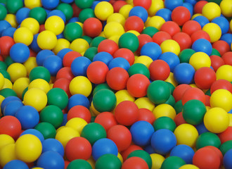 Fototapeta na wymiar Children's game complex - pool from color balls