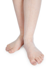 Female legs dressed in fashion stockings on white