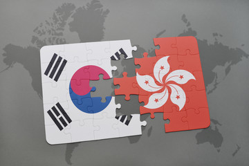 puzzle with the national flag of south korea and hong kong on a world map background.