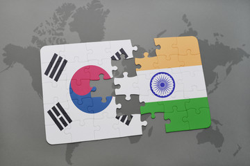puzzle with the national flag of south korea and india on a world map background.