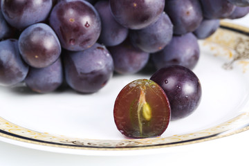 The close-up of Peeled  Red Grape on plate