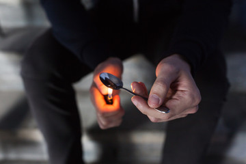 Fototapeta premium close up of addict preparing crack cocaine drug
